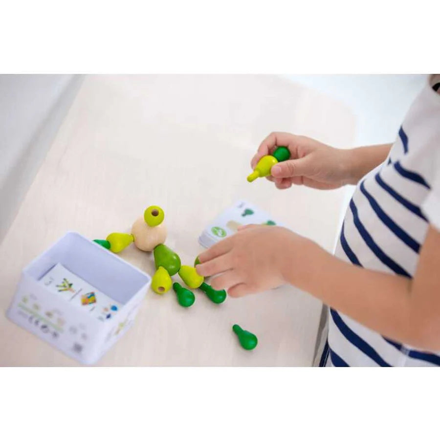 child playing with PlanMini Balancing Cactus Game