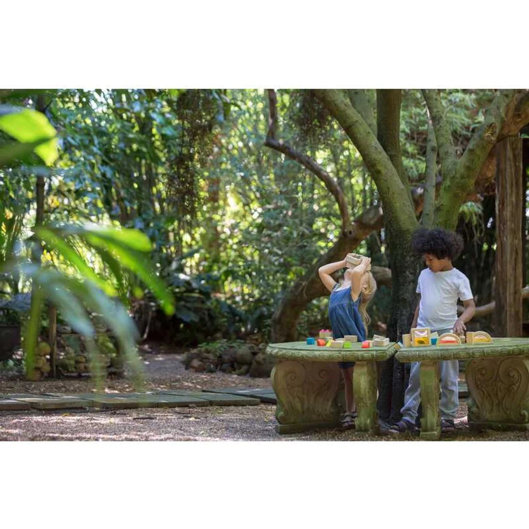 children playing with water blocks outside