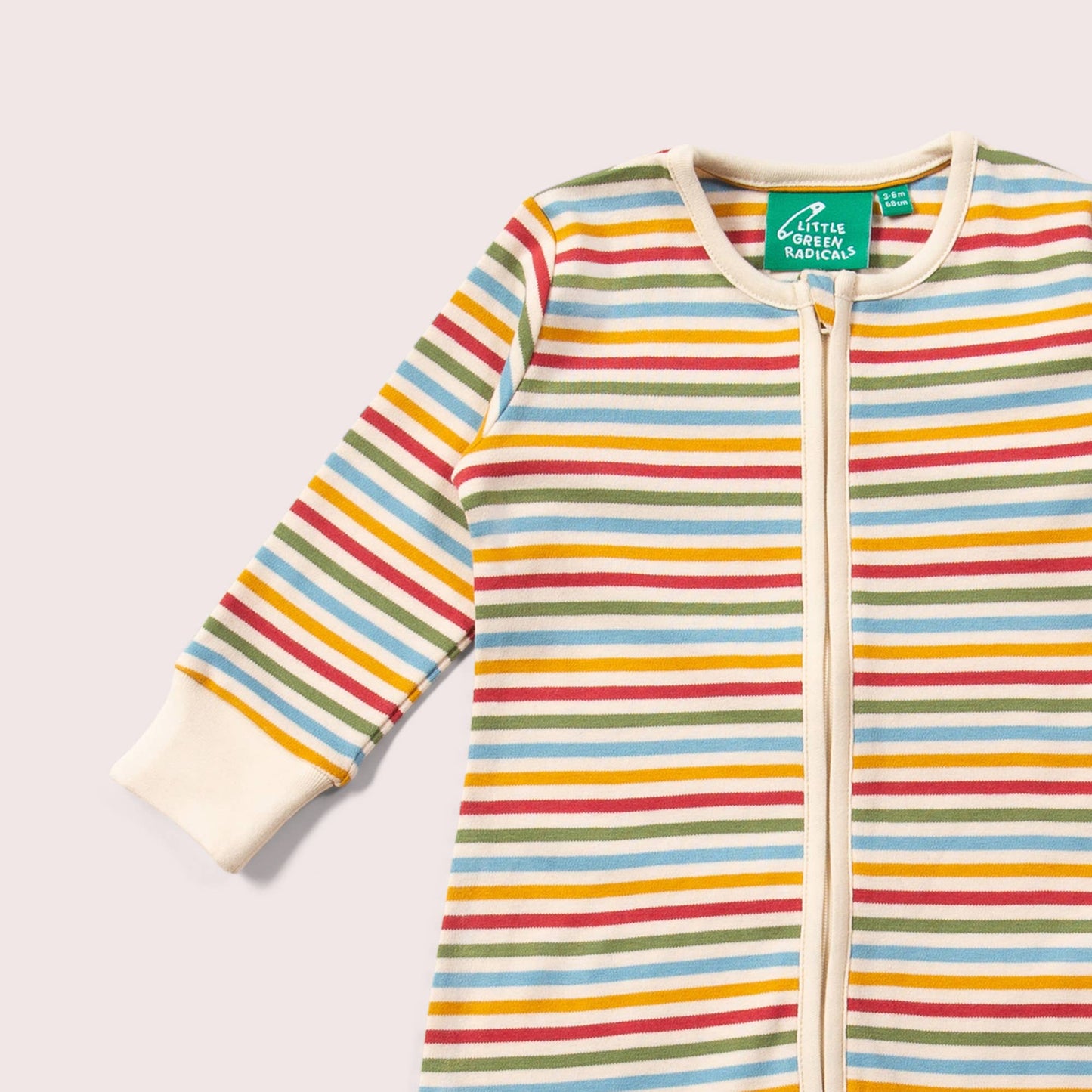 Cream Rainbow Zip Organic Footed Romper by little radicals on a light grey back ground