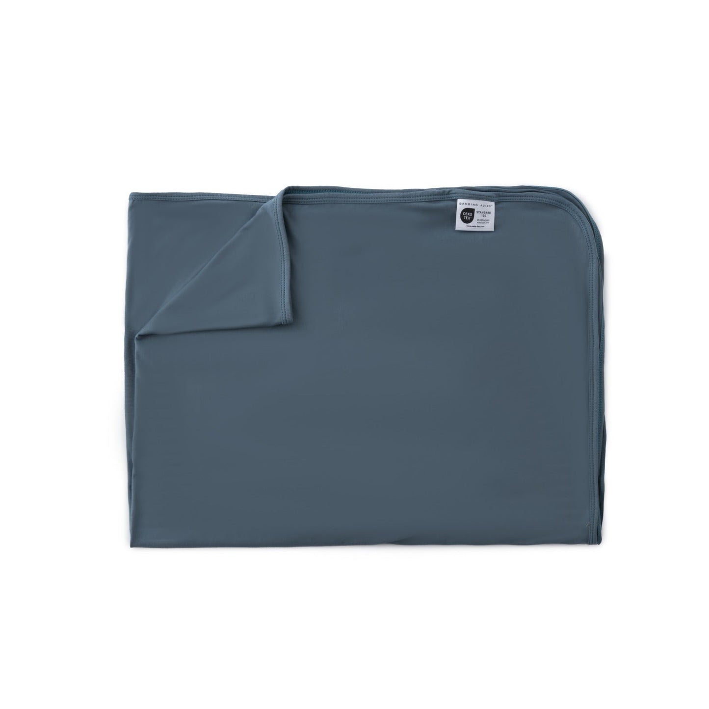 Folded blue blanket with a label on a white background
