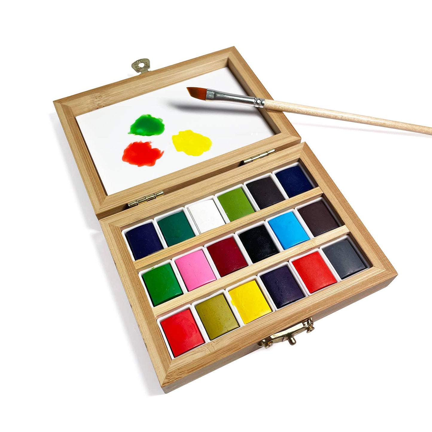 Wooden watercolor paint set with paintbrush on a white background