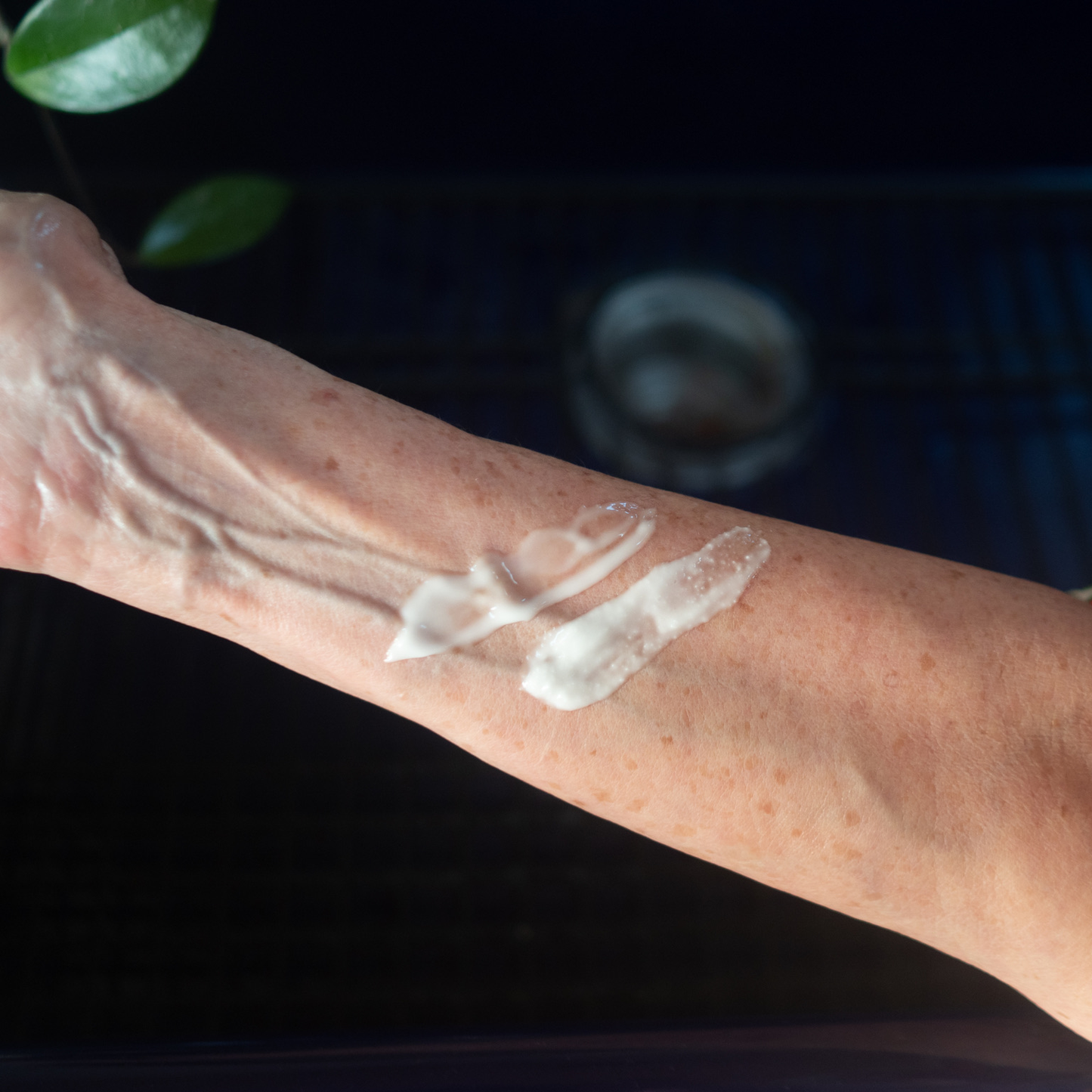 two swatches of aloe lotion on someone's arm
