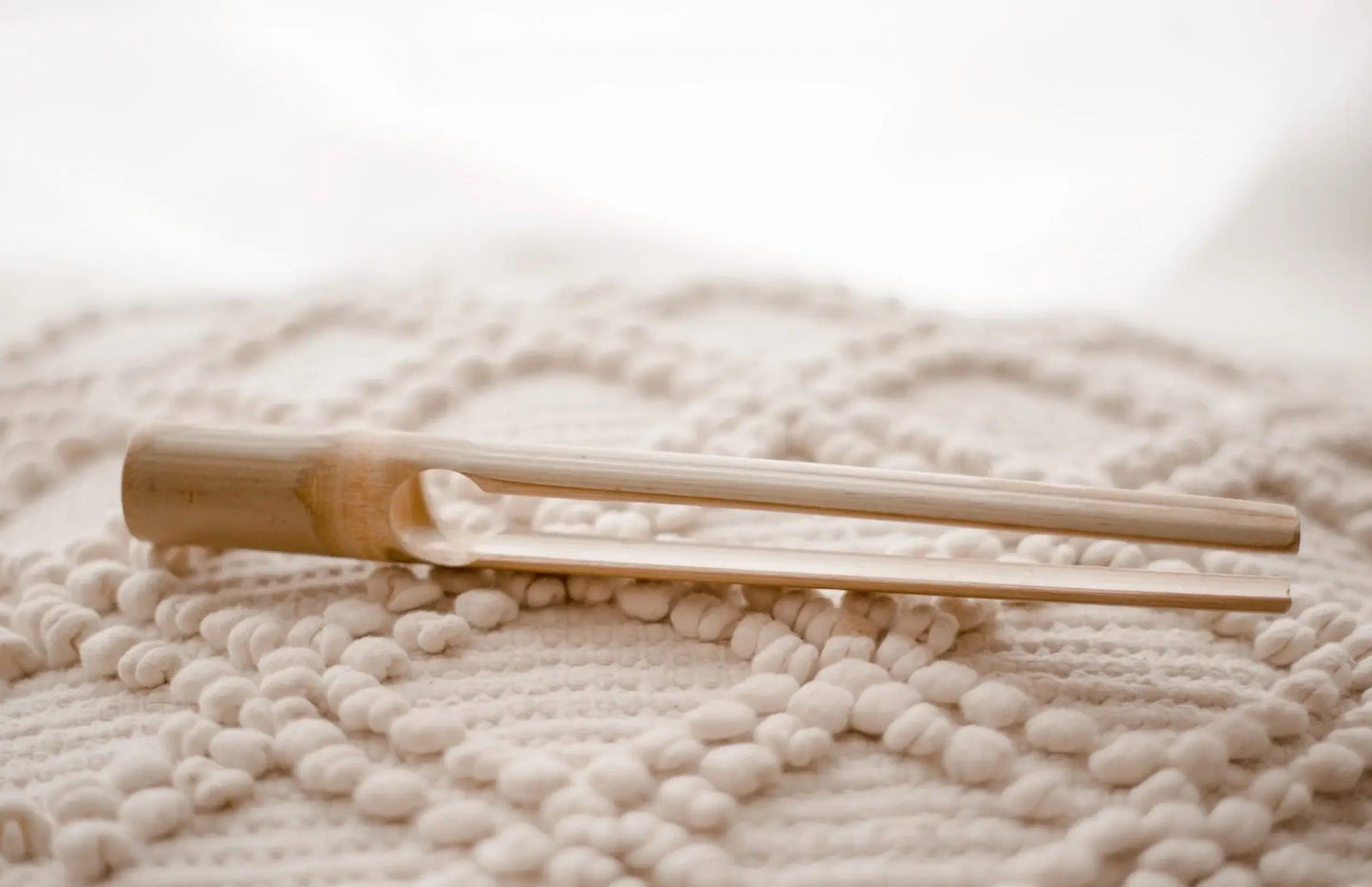 bamboo tongs on a blanket