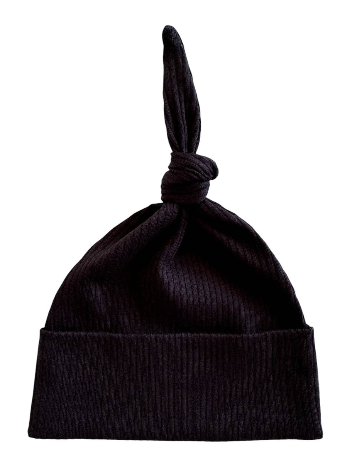 Black ribbed baby knot hat on a white background