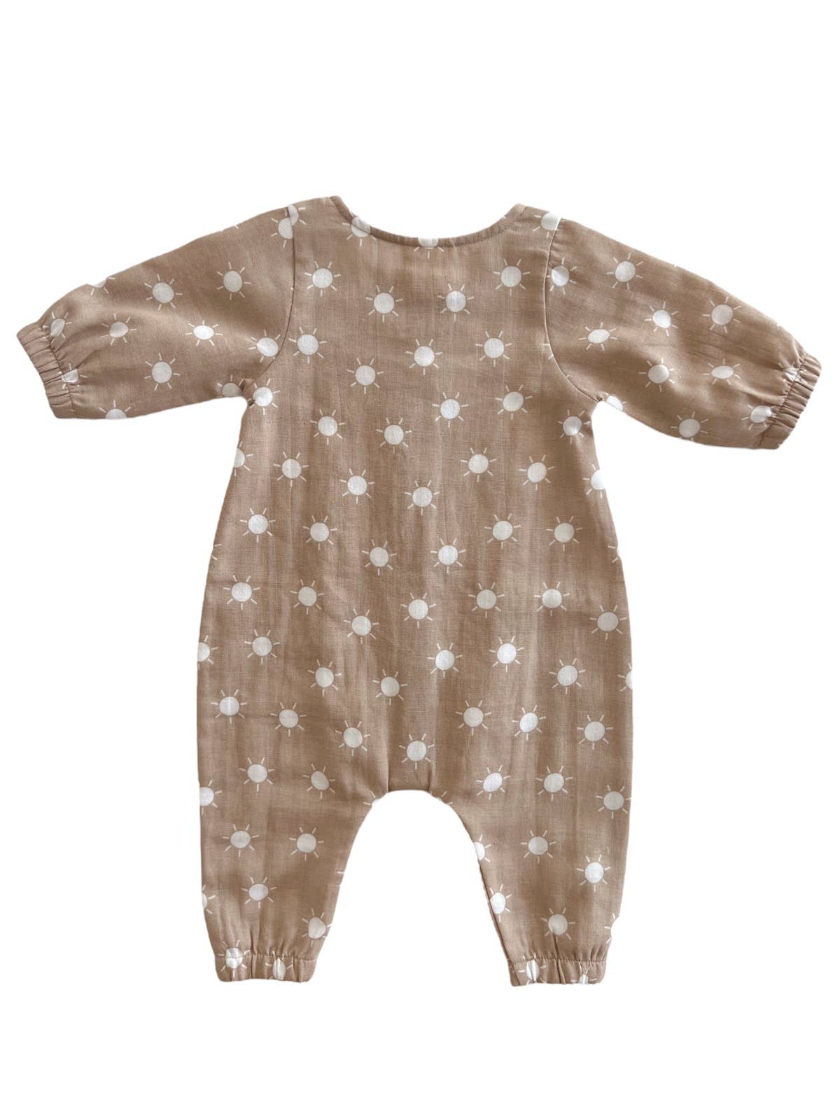 Brown baby romper with white suns pattern on a white background