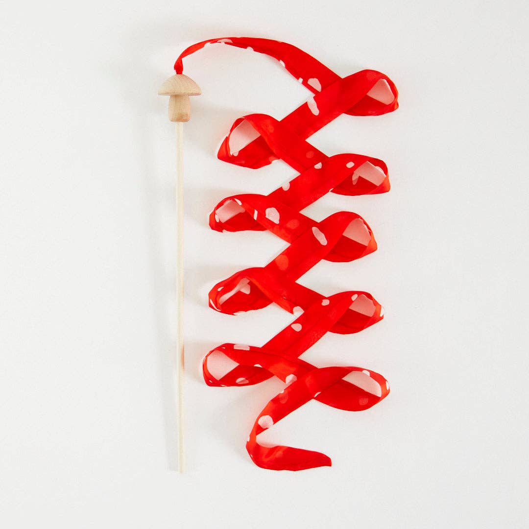 Red mushroom streamer wand on a white background
