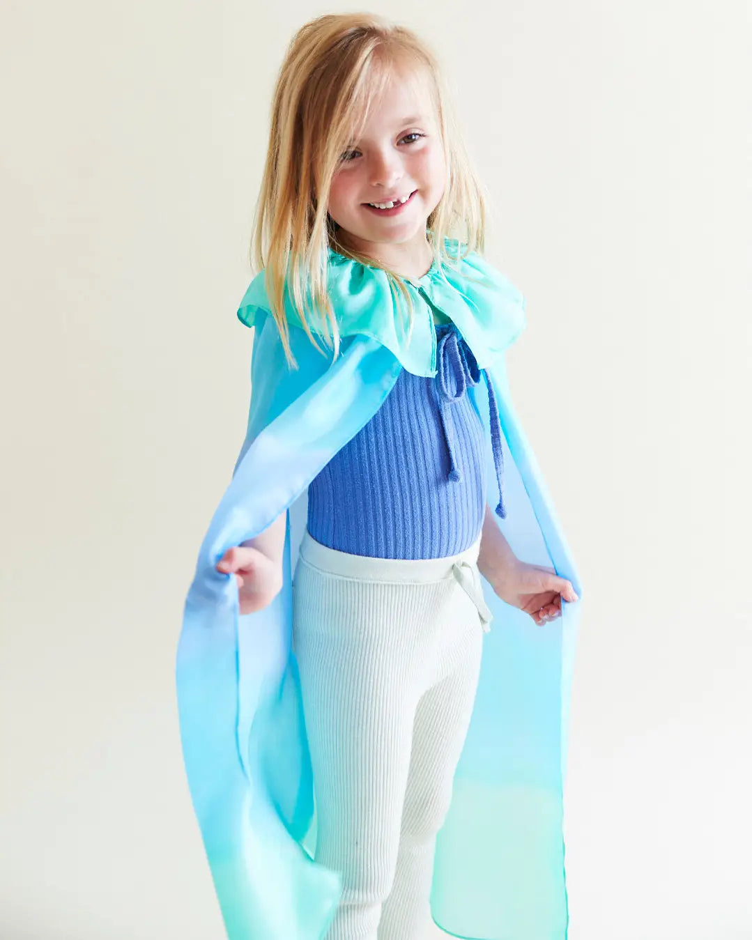 Child wearing Mermaid Reversible Silk Play Cape