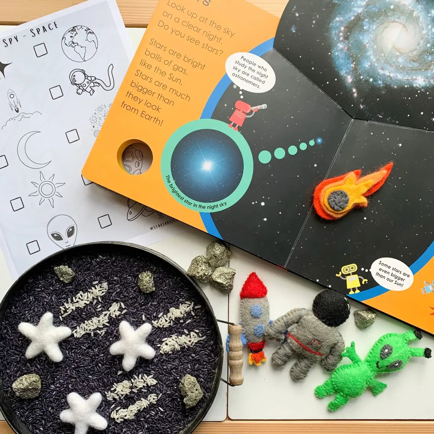 books, felt figures, and rocks to learn about space