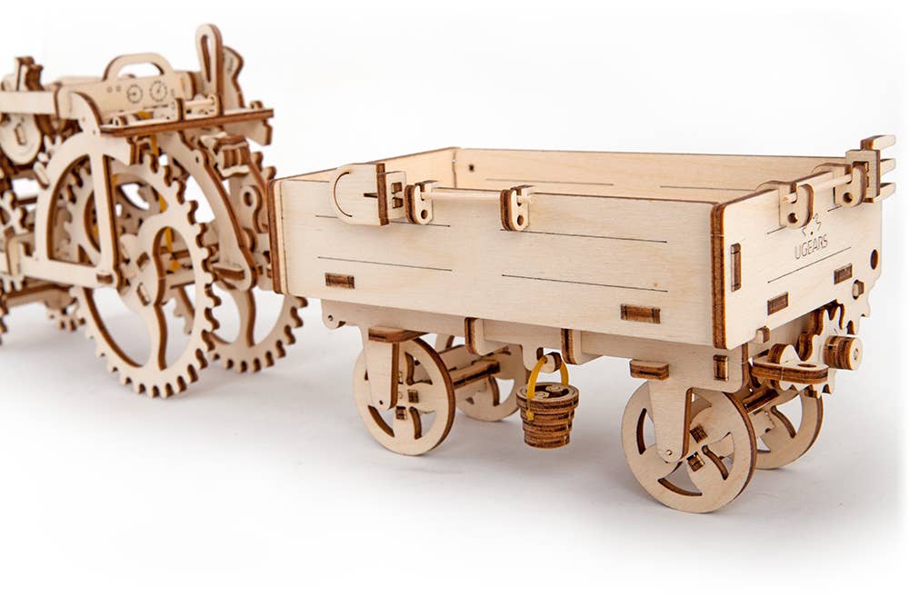 Wooden mechanical model of a trai with gears on a white background