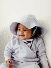Load image into Gallery viewer, baby wearing lavender stars muslin sun hat and matching romper
