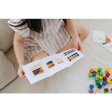 Load image into Gallery viewer, Child checking out the instructions for the 100 Counting Cubes - Unit Plus
