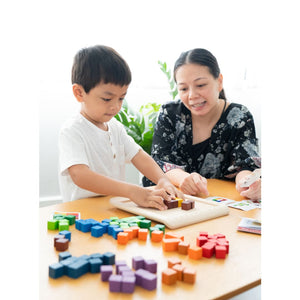 Adult and child playing with 100 Counting Cubes - Unit Plus