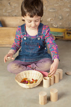 Load image into Gallery viewer, child filling natural cups with beans and beads
