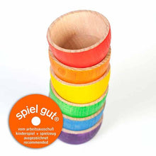 Load image into Gallery viewer, A set of six rainbow wooden bowls, stacked on top of each other in the rainbow colors order from top to bottom
