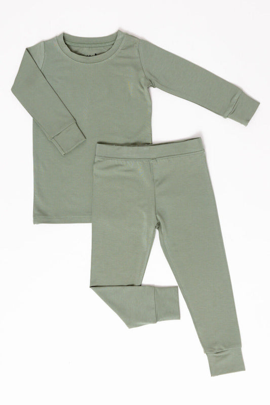 Green long-sleeve shirt and pants set on a white background