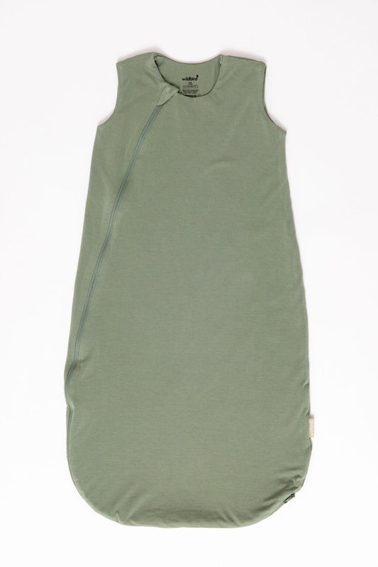 Green baby sleeping bag with zipper on a white background