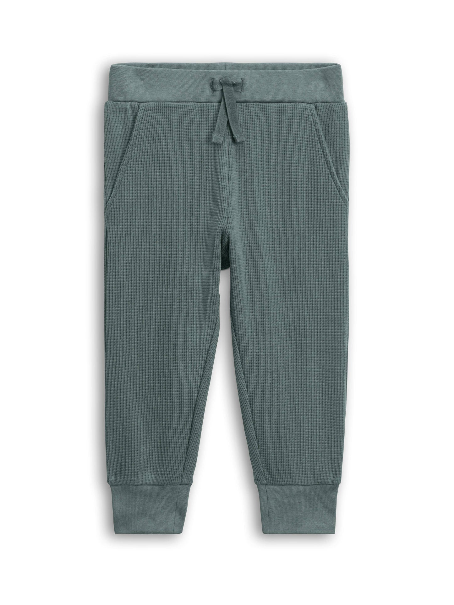 Green textured jogger pants on a white background