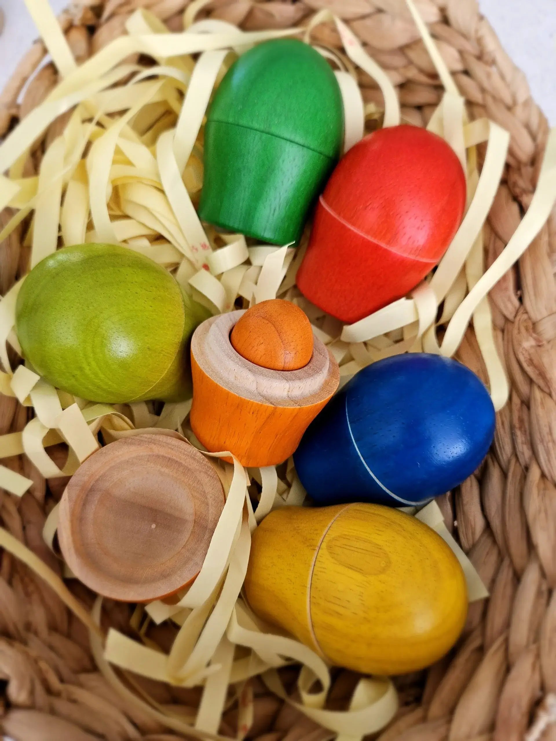 Colorful wooden toys in a woven basket