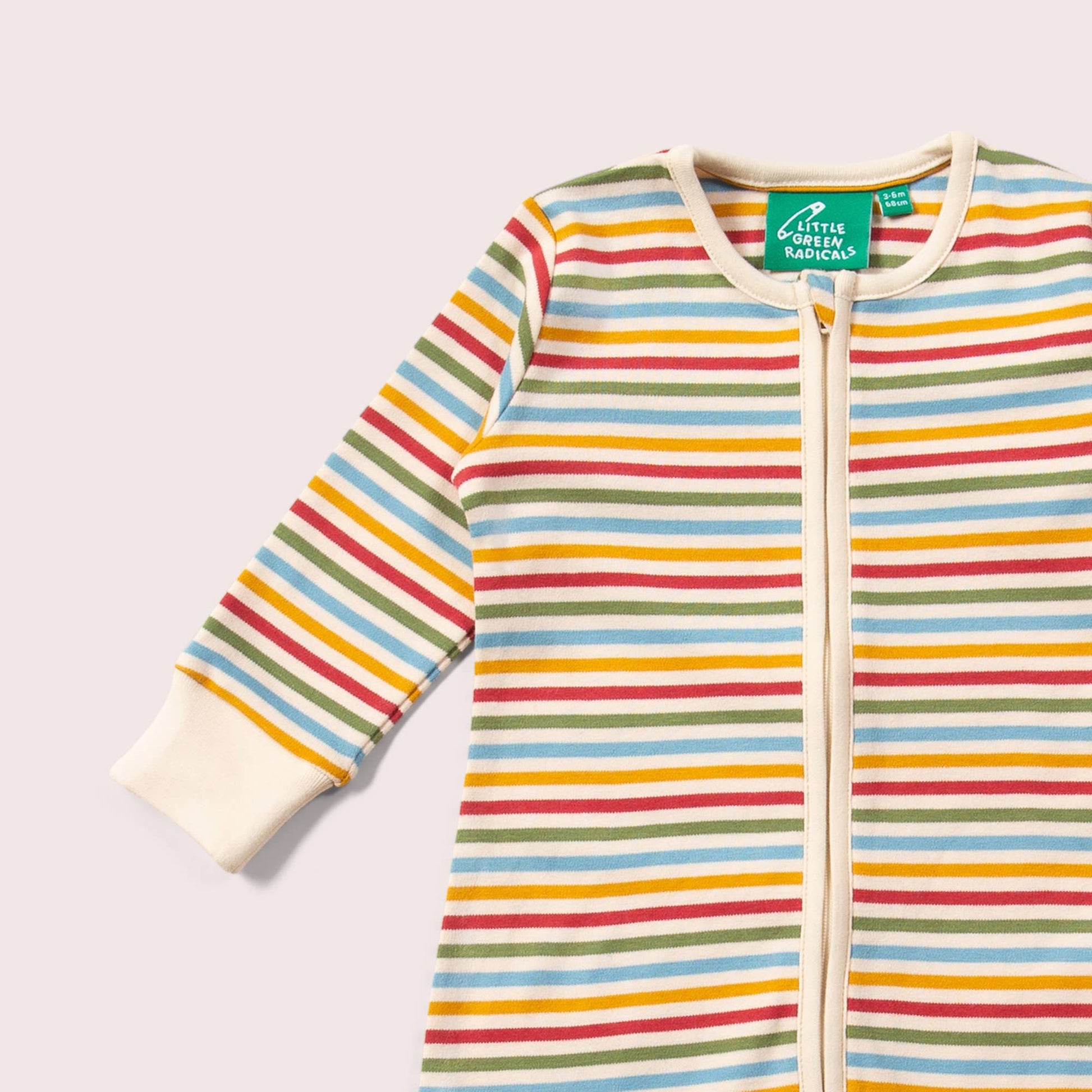 Cream Rainbow Zip Organic Footed Romper by little radicals  on a light grey back ground 