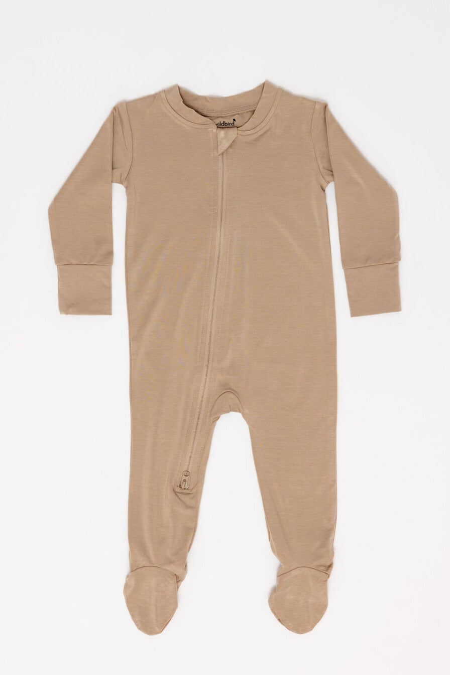 Beige baby onesie with a zipper on a white background