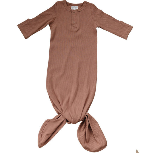 Brown ribbed baby gown on a white background