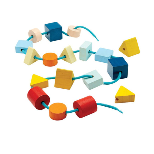Colorful wooden shape sorting toy on a white background
