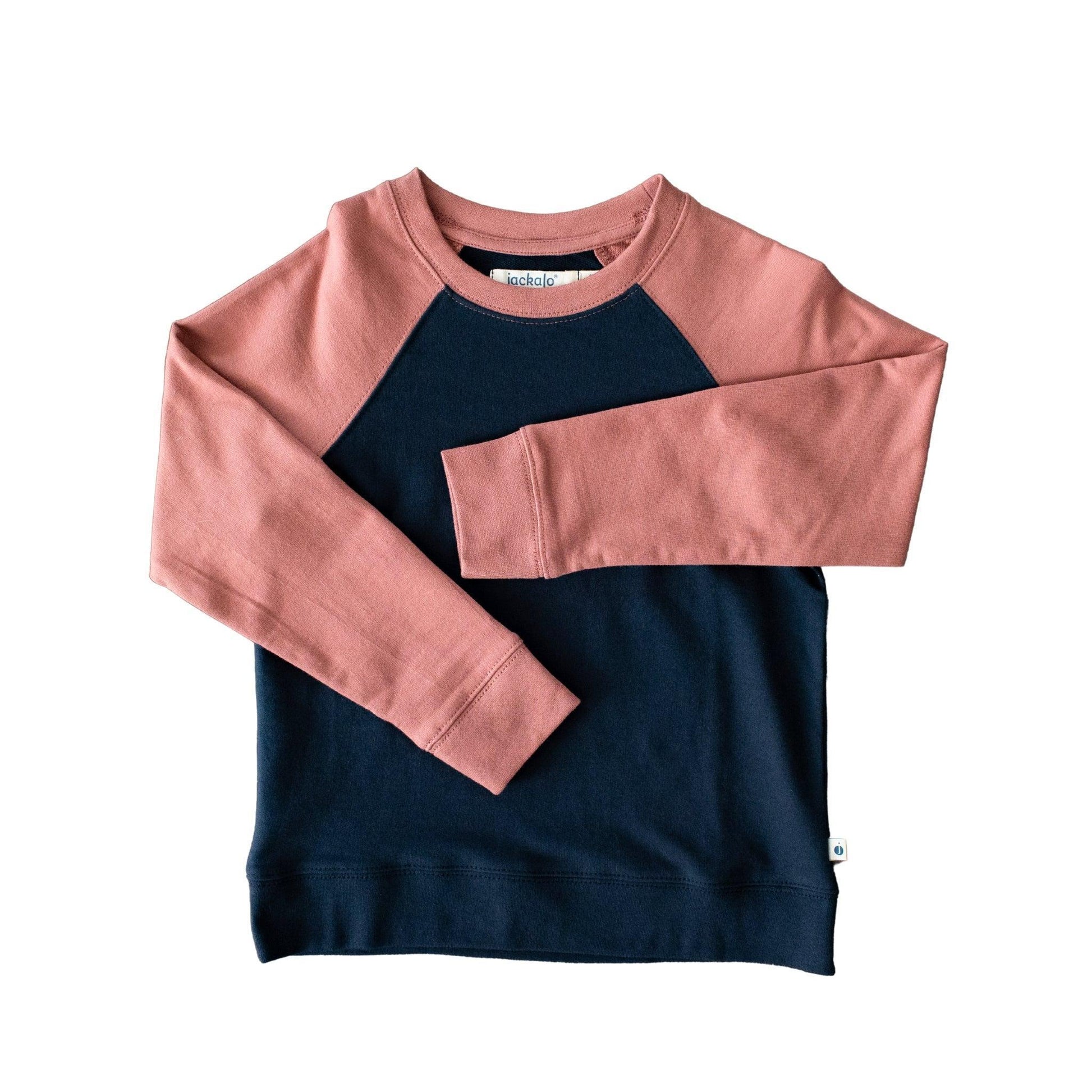 Navy and pink color-blocked sweatshirt on a white background