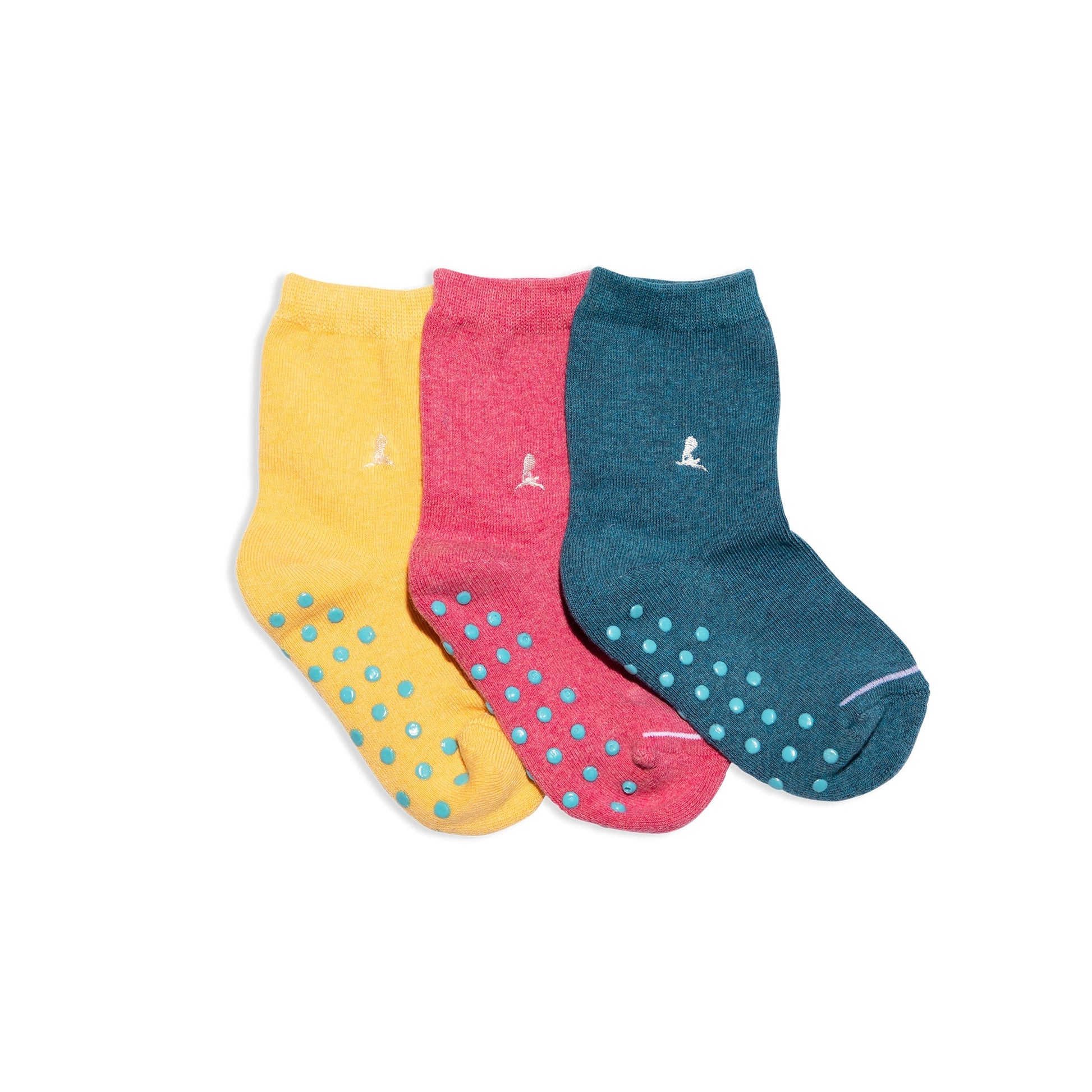 Three pairs of colorful socks with polka dot patterns on a white background