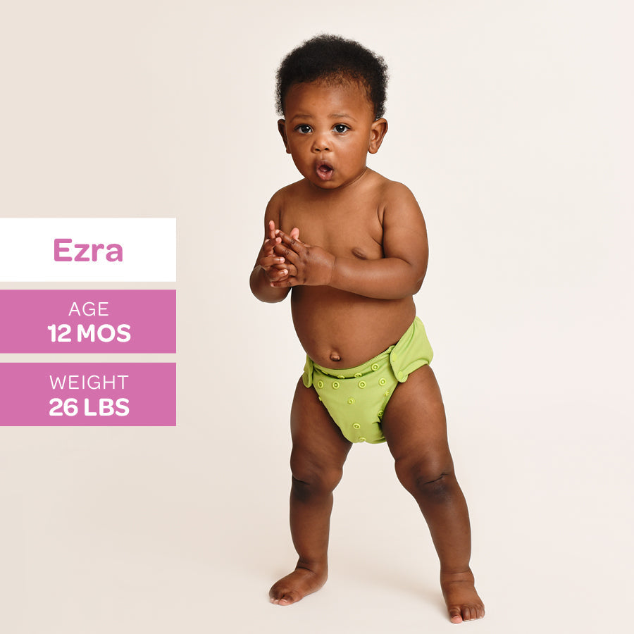 Baby in a green diaper with demographic information on a beige background