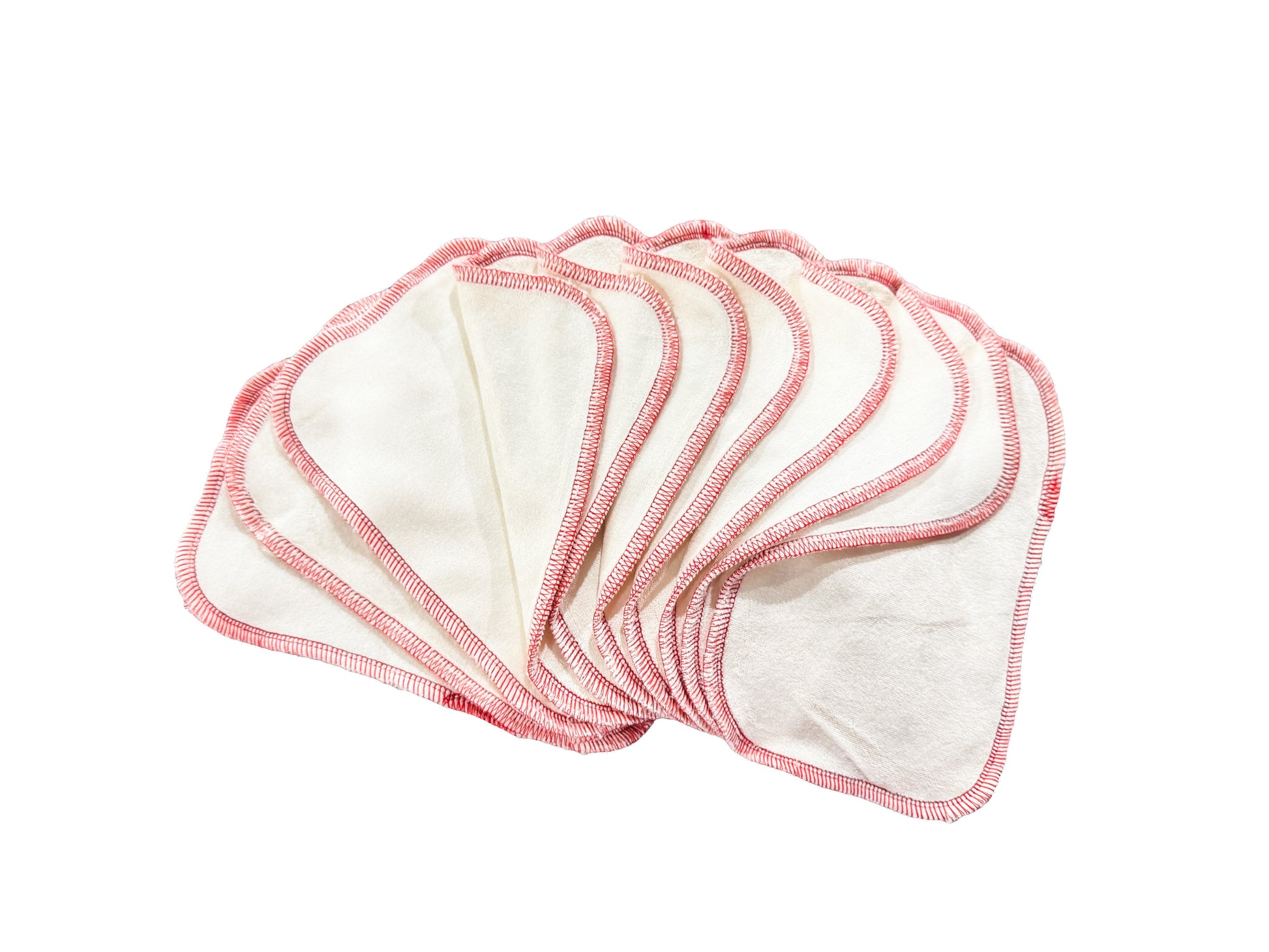 Set of white cloth pads with red edges on a white background