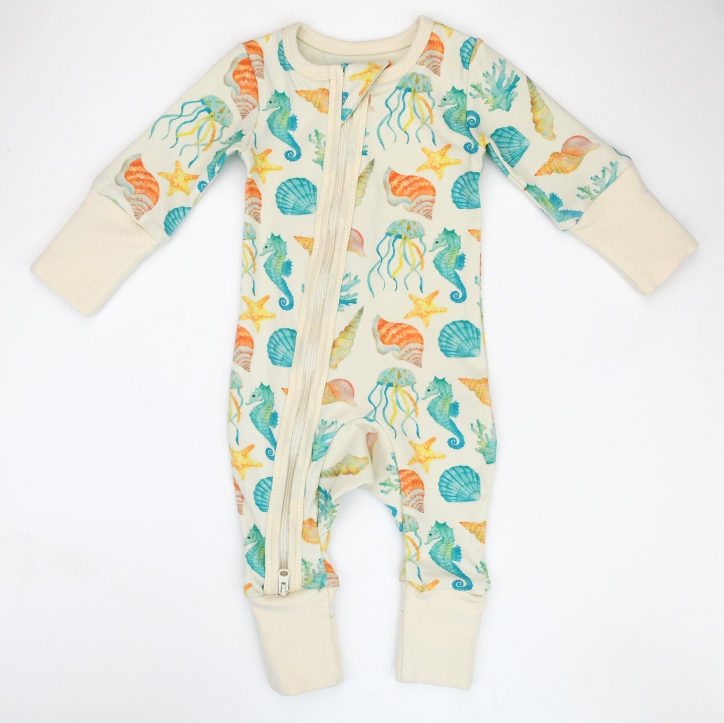 Baby onesie with sea-themed pattern on a white background