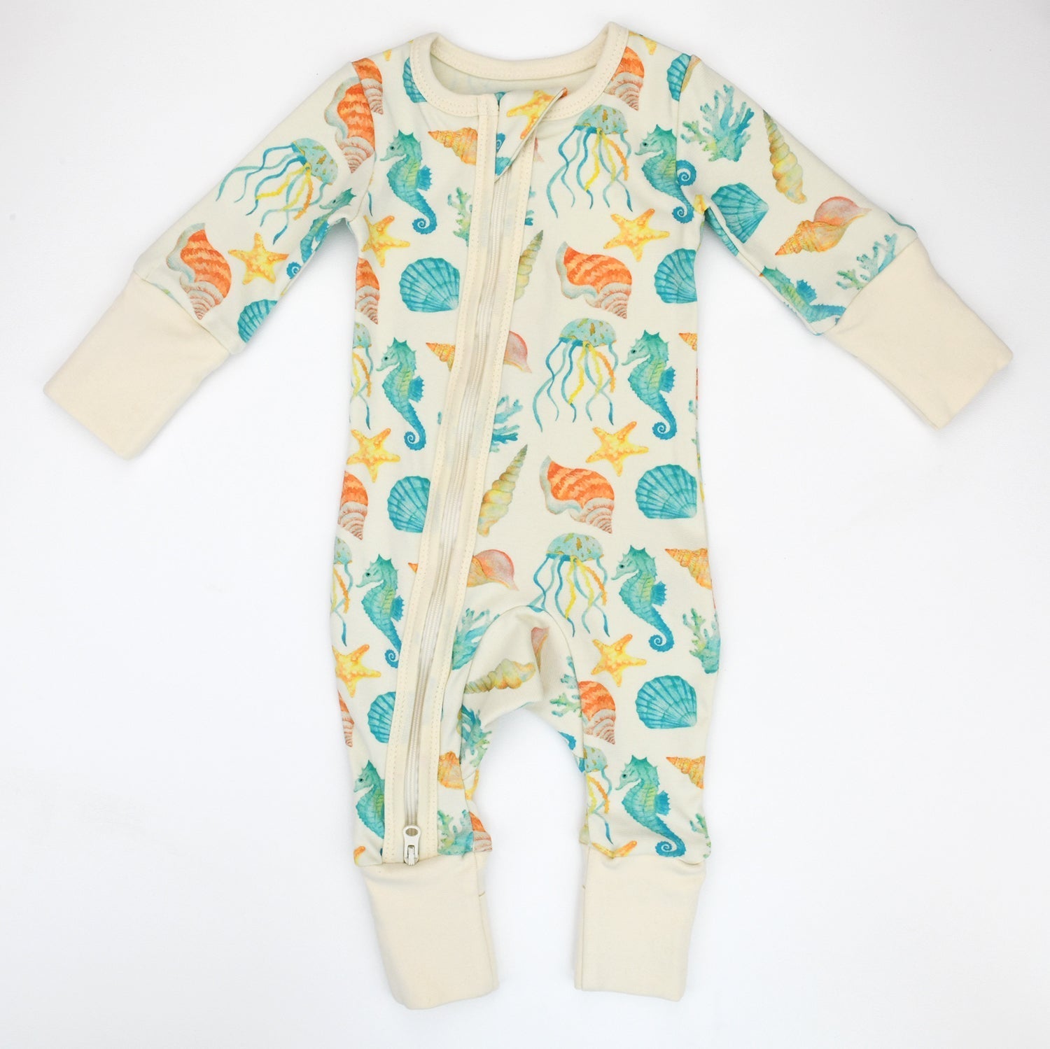 Baby onesie with sea-themed pattern on a white background