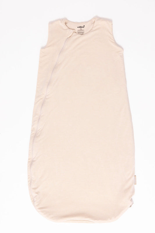 Beige baby sleeping bag on a white background