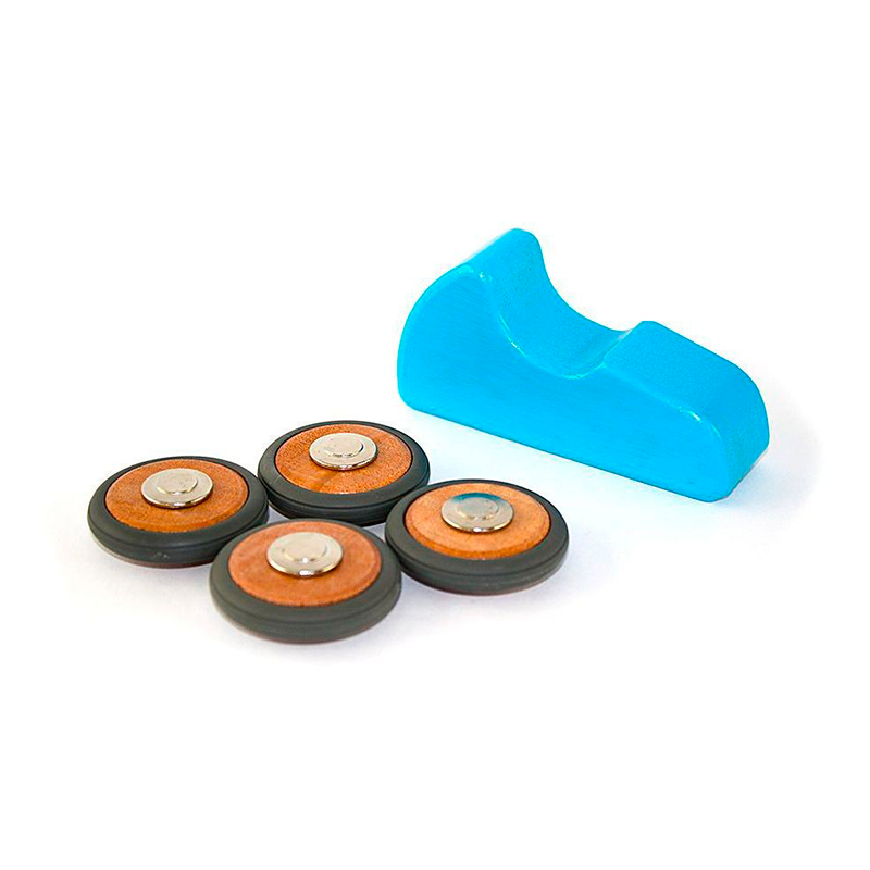 Four round orange and black components with a blue plastic tool on a white background