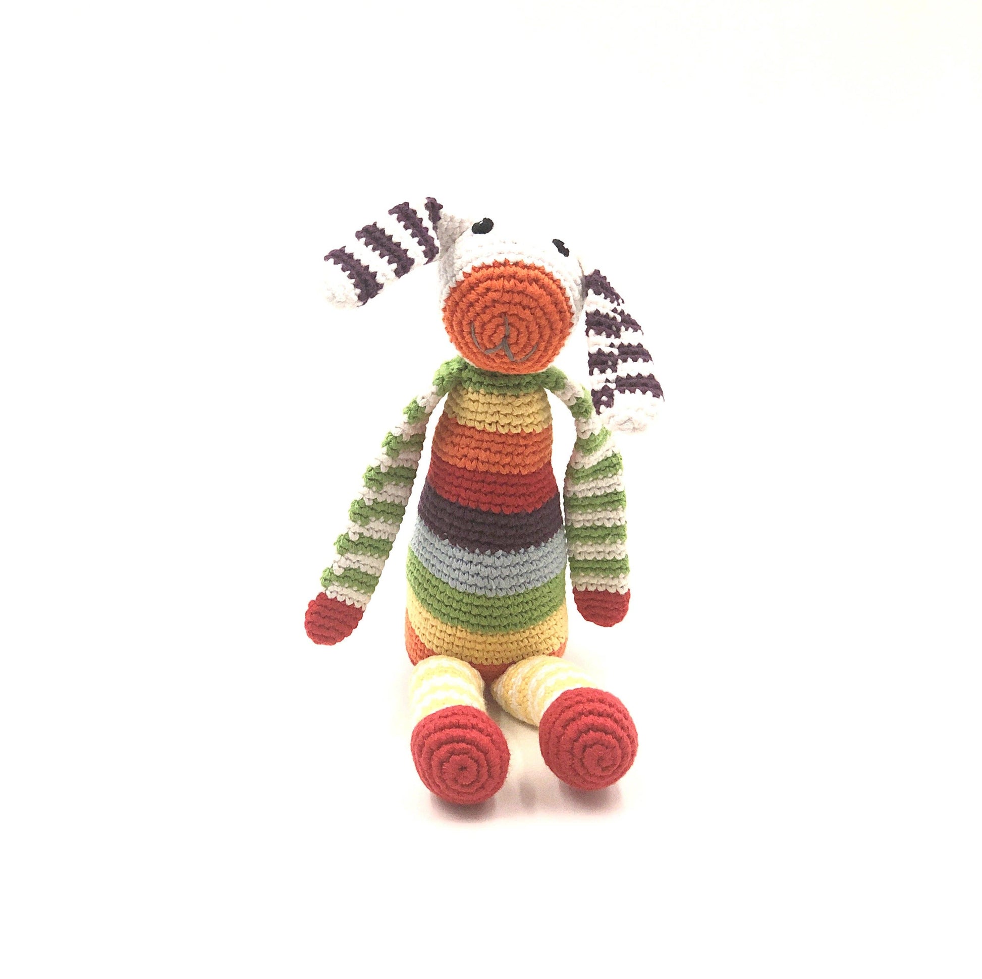 Colorful striped toy bunny on a white background