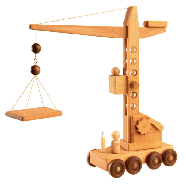 Wooden toy crane model on a white background