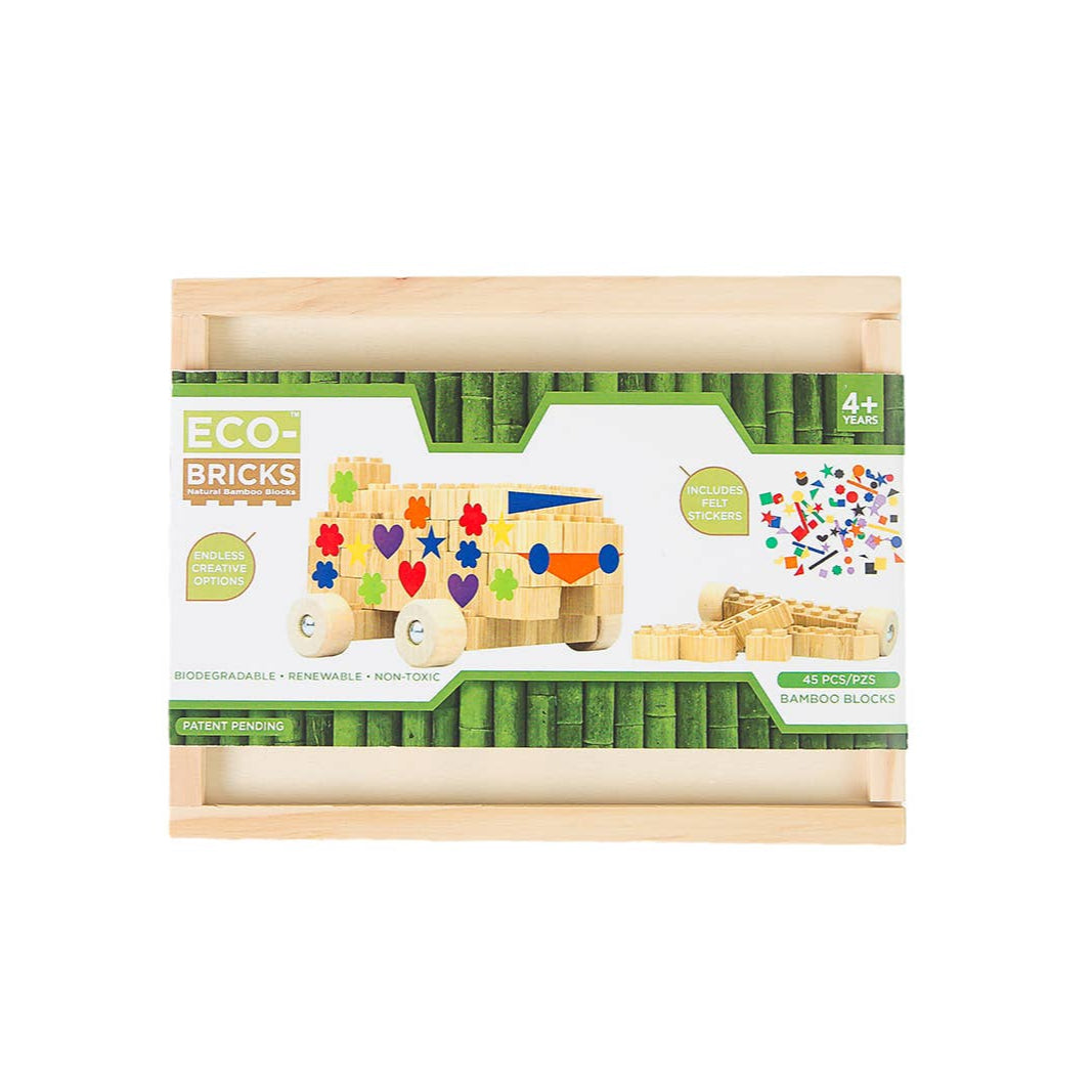 Box of eco-friendly bamboo building bricks with felt shapes on a white background
