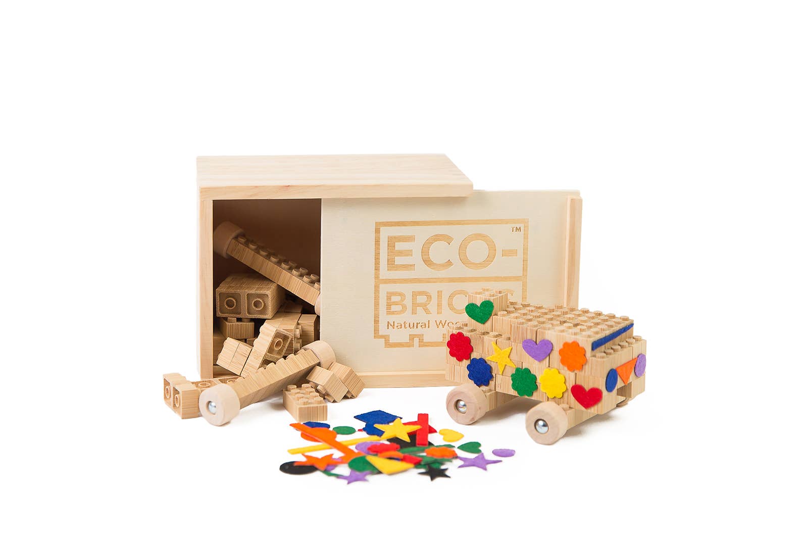 Wooden toy truck built with bamboo blocks and colorful felt shapes and 'Eco-Brick' packaging on a white background