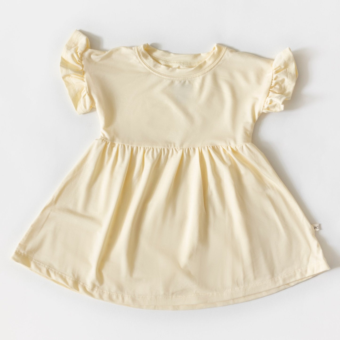 Beige dress with puff sleeves on a white background