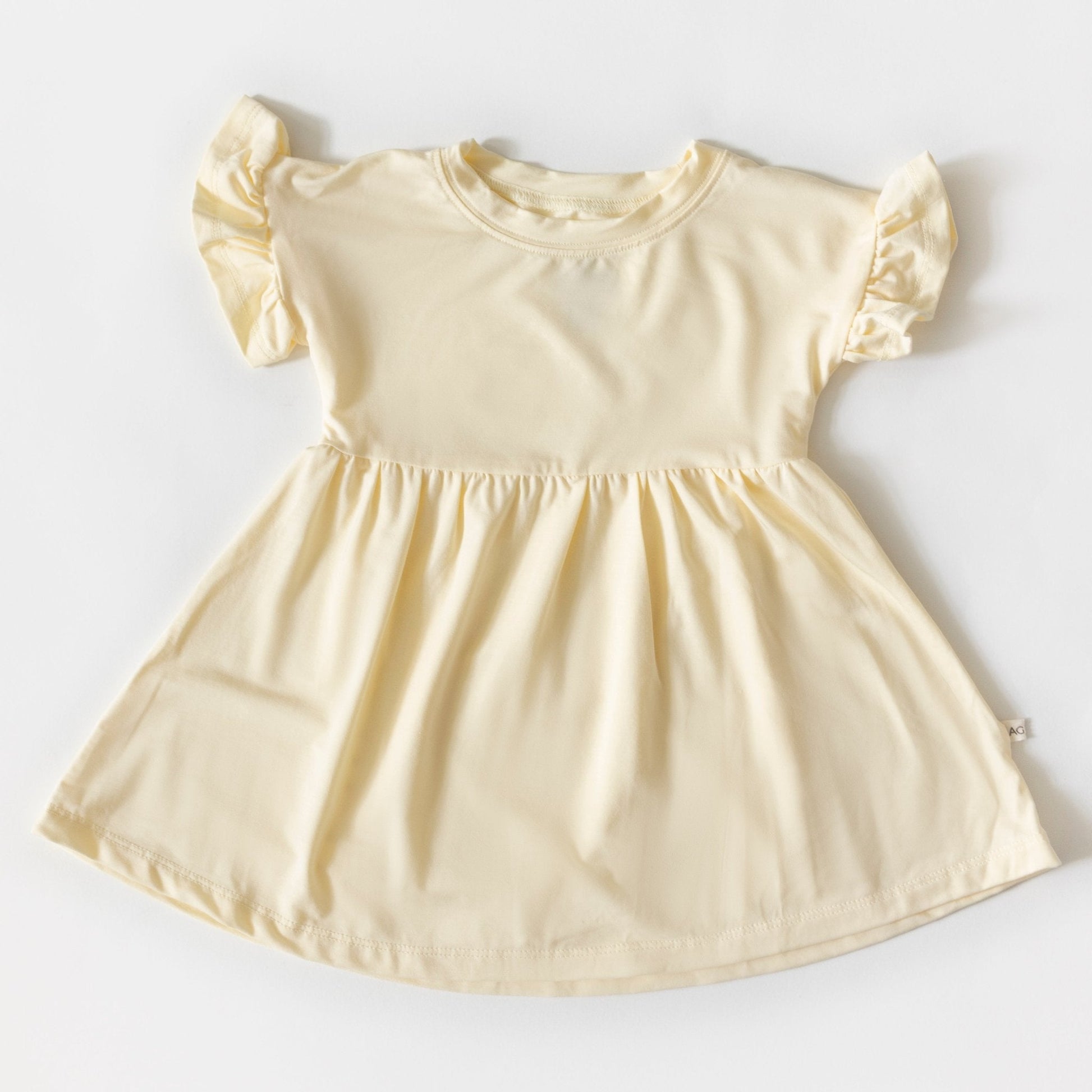 Beige dress with puff sleeves on a white background