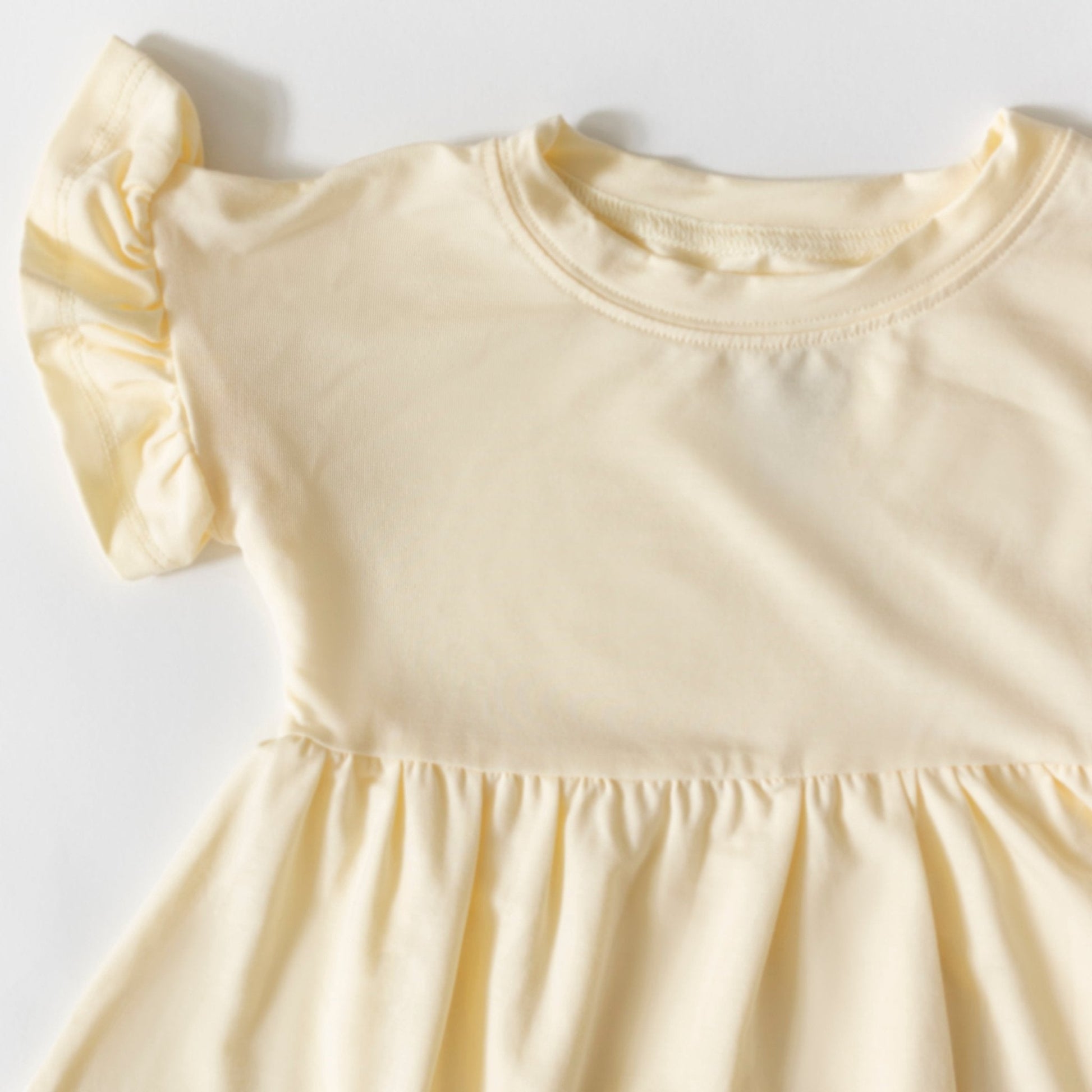 Yellow dress with short sleeves on a white background