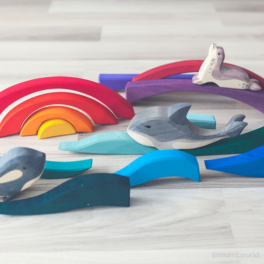 landscape puzzle pieces with wooden marine animals by Ostheimer