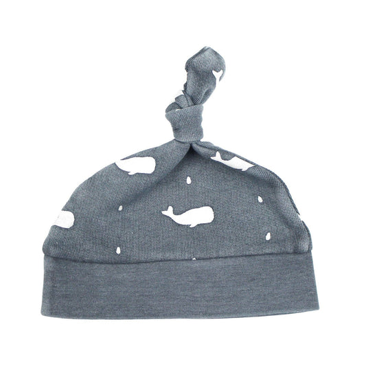 Gray baby hat with whales pattern on a white background