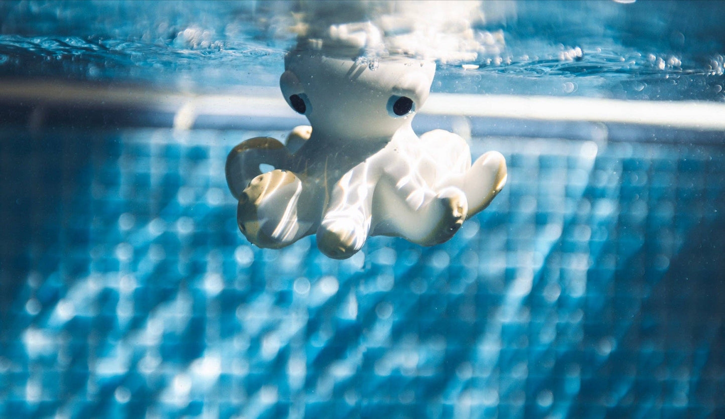 an underwater shot of natural rubber Orlando the octopus toy