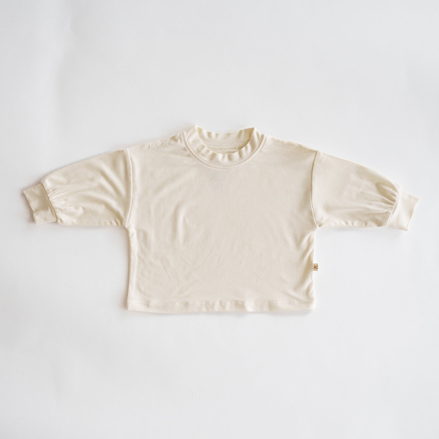 Beige long-sleeve shirt on a white background