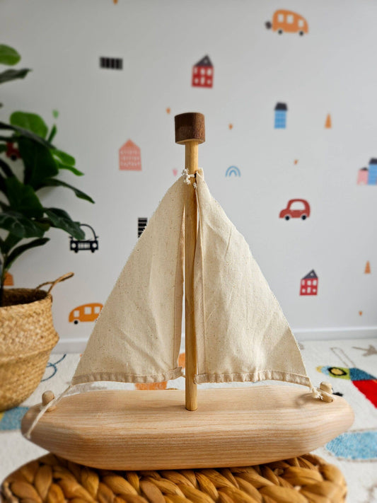 recycled sailing boat wooden toy on a table