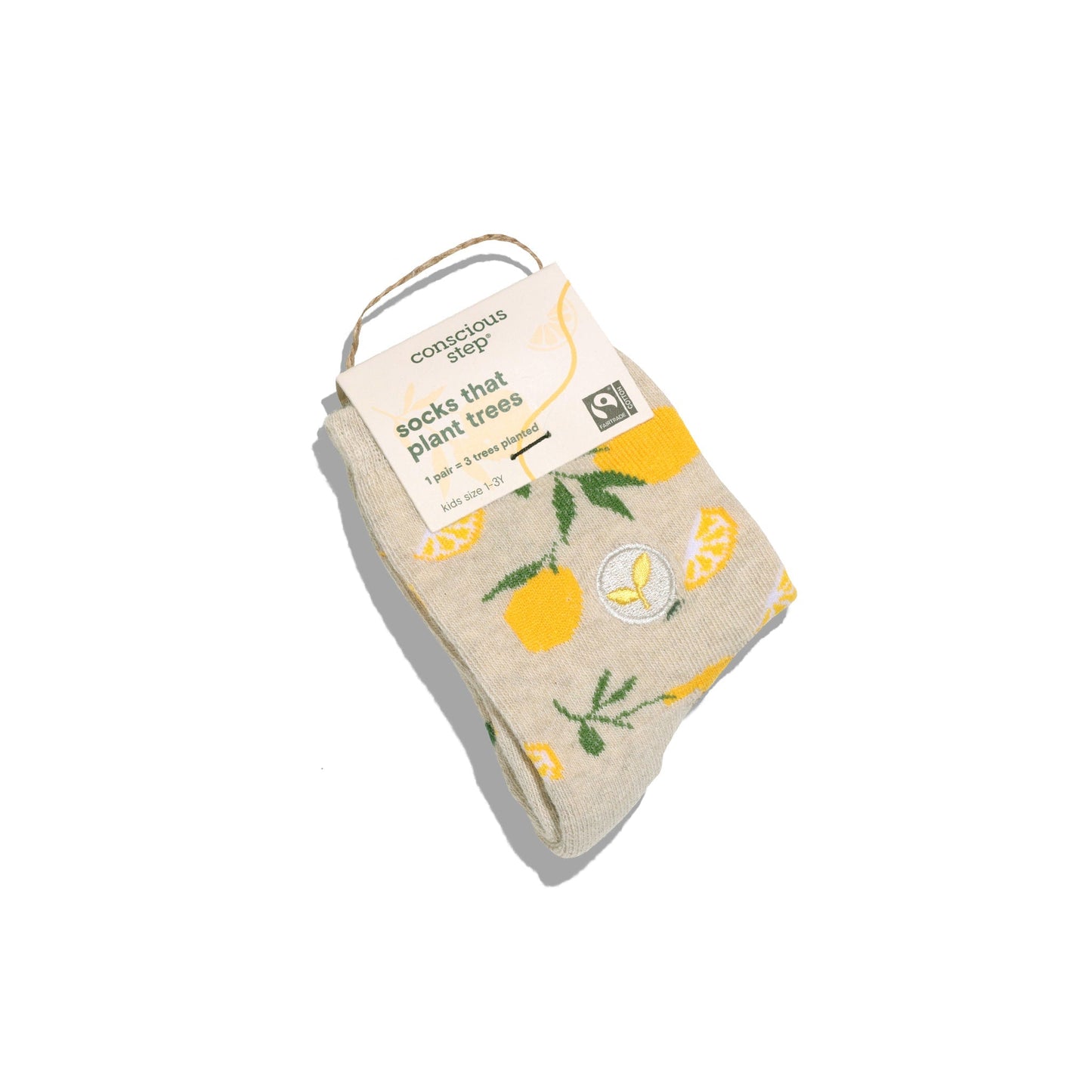 Beige sock with lemon design and 'conscious step' label on a white background