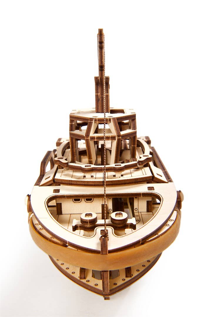 Wooden model of a ship on a white background