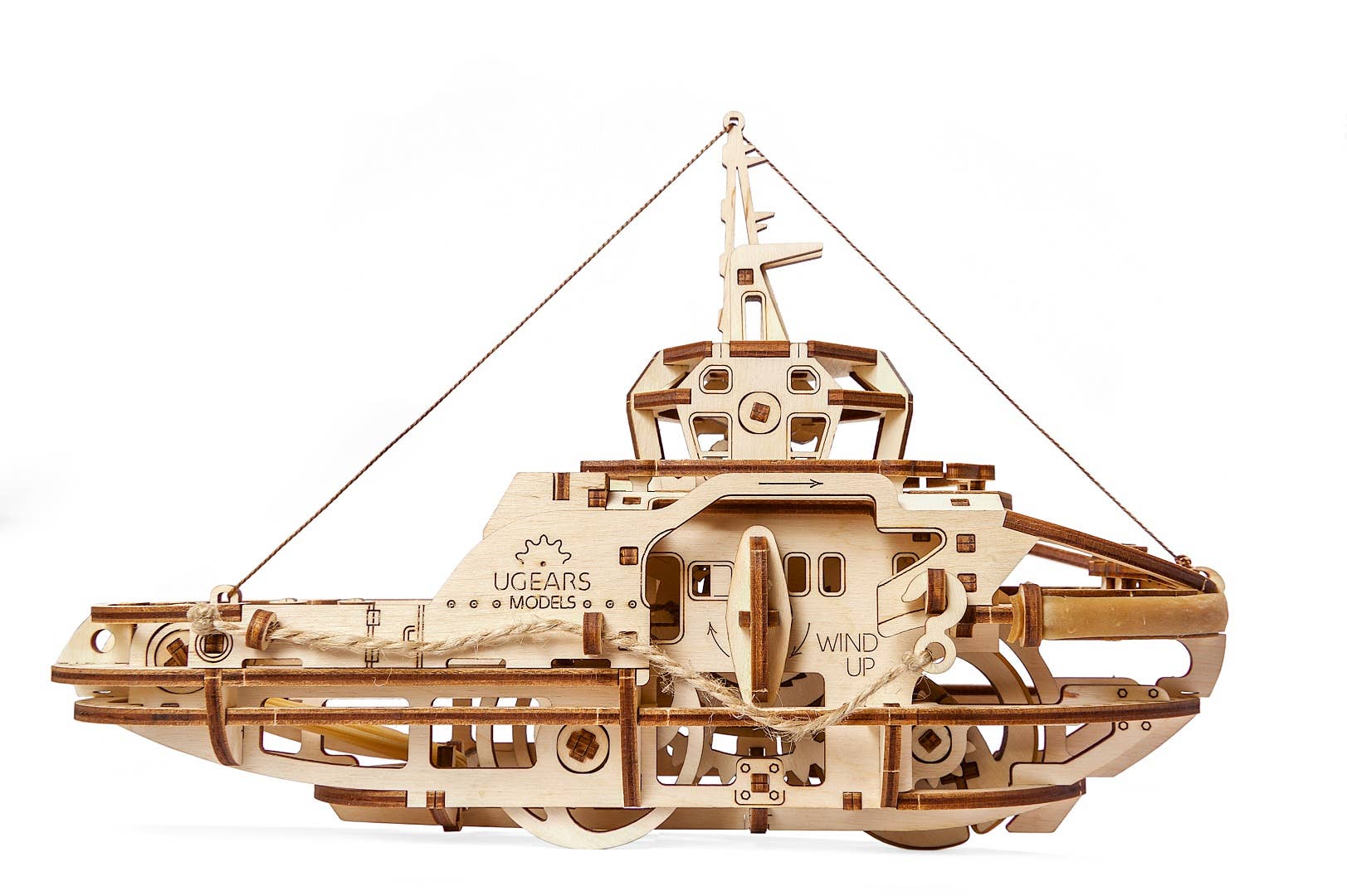 Wooden mechanical model of a tugboat with 'Ugears' branding on a white background