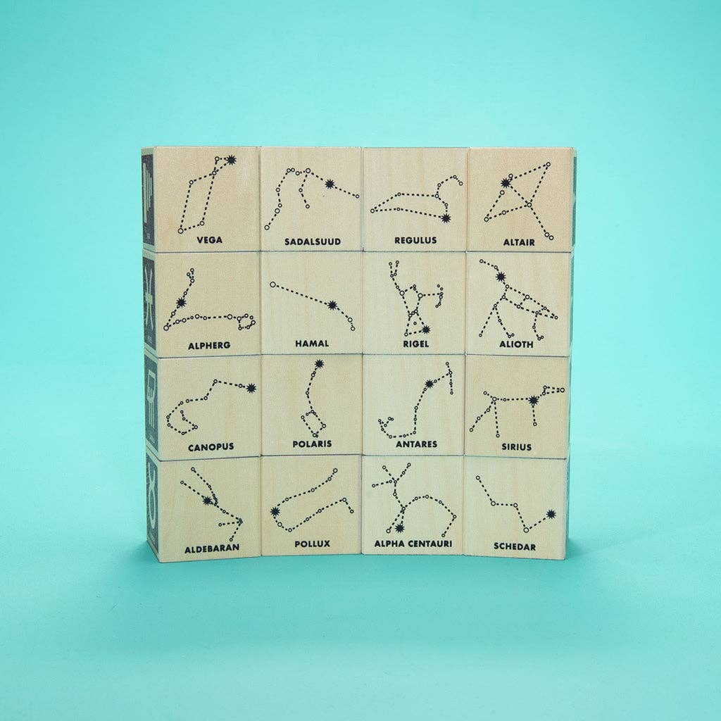 Set of wooden blocks with star constellation designs on a teal background